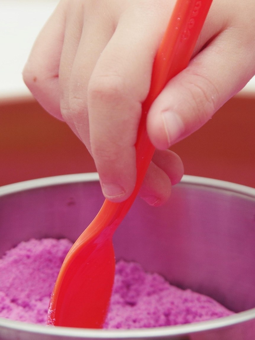 Recall issued and schools closed over asbestos risk in coloured sand